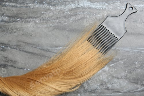 Preview: Flat lay composition with strand of hair and comb on grey background. Space for text