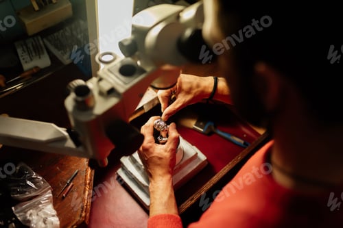 Preview: jeweler working with a microscope