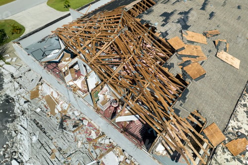 Preview: Damaged house roof and walls after hurricane Ian in Florida. Consequences of natural disaster