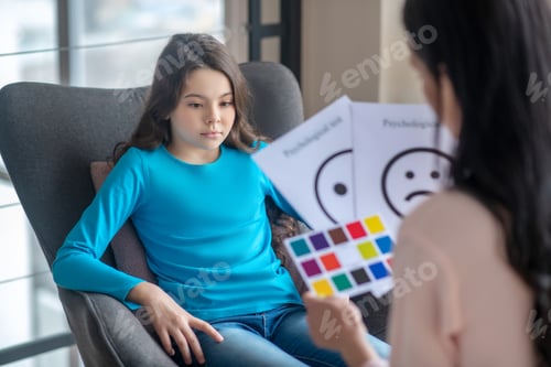 Preview: Long-haired teen in a blue shirt undergoing the psychological test