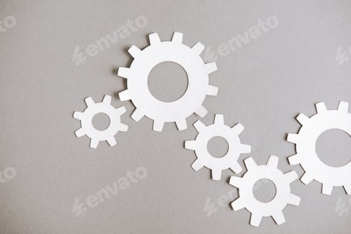 Preview: top view of white gears on grey background
