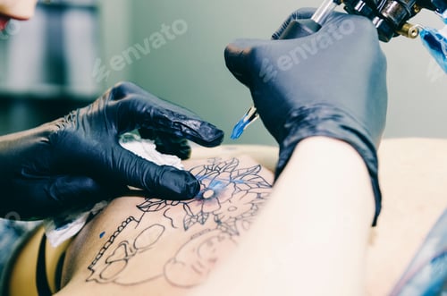 Preview: Tattoo Artist at Work, Applying Floral Design