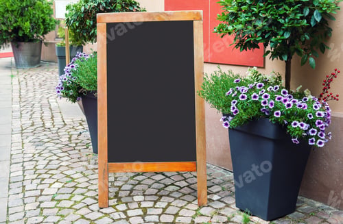Preview: Blank menu blackboard on the street with flower pots and green plants, empty restaurant menu mockup