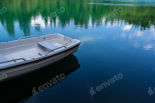 Preview: Boat in a lake in the Grisons Mountains in Switzerland