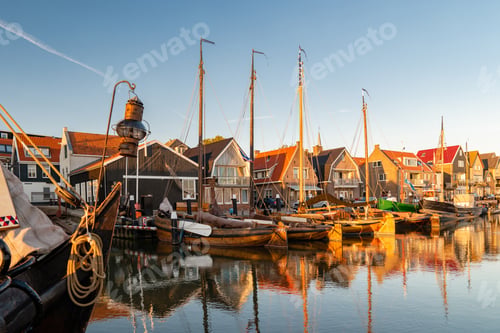 Preview: Urk Flevoland Netherlands sunset at the lighthouse and harbor of Urk Holland
