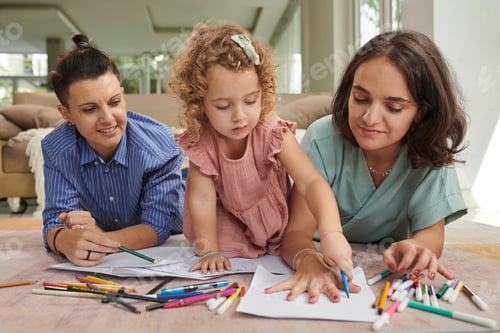 Preview: Little Girl Tracing Hand of Mother