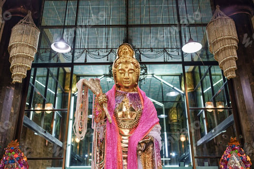 Preview: Golden Guan Yin statue with pink robe and pearl decorative inside glass temple