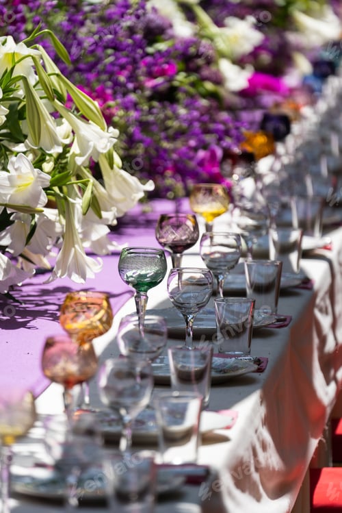 Preview: Laid celebration dinner table with empty beautiful tableware for holiday outdoor in summer sun day.