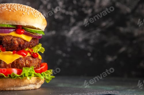 Preview: Half shot of delicious meat sandwich with tomatoes green on dark color tray on blurred background