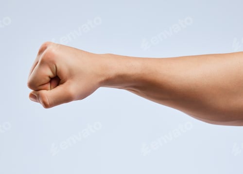 Preview: Shot of an unrecognizable man holding his fist up against a white background