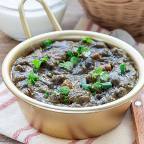 Preview: Homemade black bean and ham soup in aluminum bowl on wooden table, top view, square