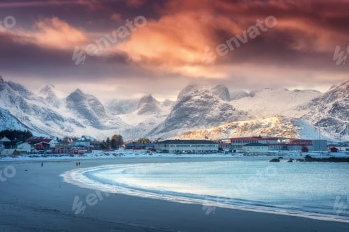 Preview: Beautiful arctic sandy beach, sea and snowy mountains at sunset