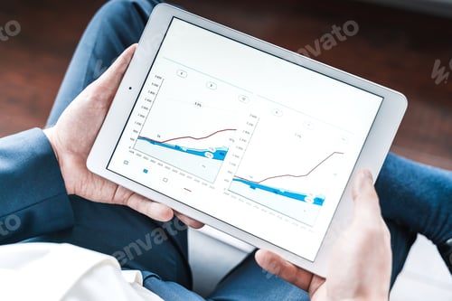 Preview: Working businessman,investor,trader.Financial report,presenatation in tablet.Diagram,gantt chart, an