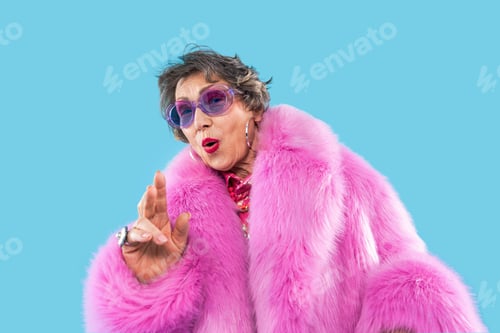 Preview: Happy and funny senior old woman on colorful background
