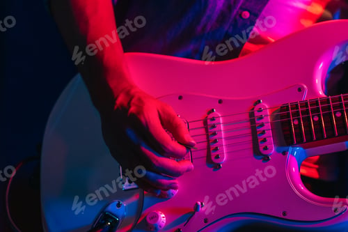 Preview: Musician Playing Electric Guitar During Live Concert