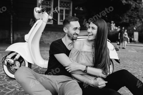 Preview: Cute couple with their scooter in the city