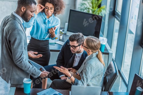 Preview: multicultural businesspeople having conversation in office
