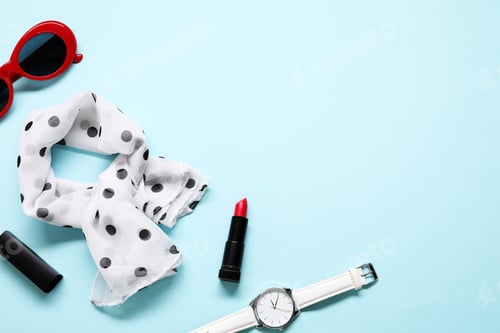Preview: Flat lay composition with stylish accessories on light blue background. Space for text
