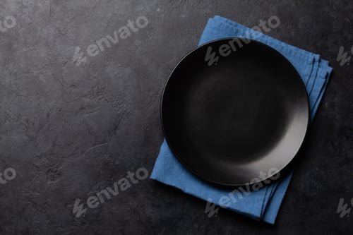 Preview: Empty plate and towel on stone table