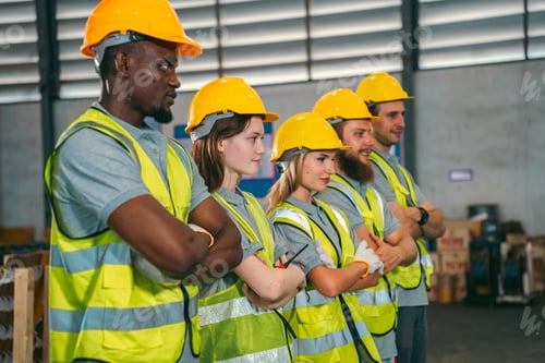 Preview: Group of various national engineer professional successful team corporate workers in factory
