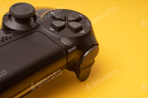 Preview: Closeup shot of a game controller on a yellow background