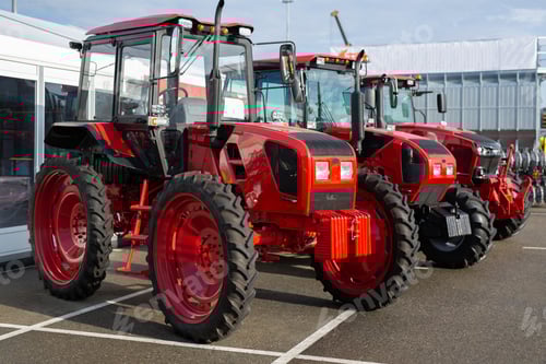 Preview: Row of Red Tractors on Display Outside