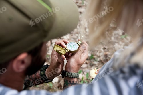Preview: Father showing compass to daughter