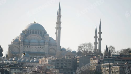Preview: Beautiful mosque towers over city. Action. Great Mosque with its minarets and blue domes stands at