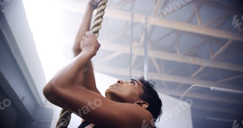 Preview: Exercise, woman and rope climbing at gym for strength training, cardiovascular health and flexibili