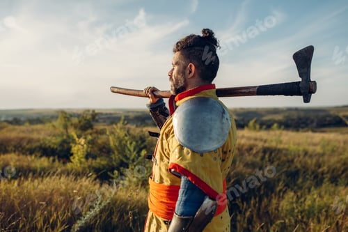 Preview: Medieval knight with axe poses in armor