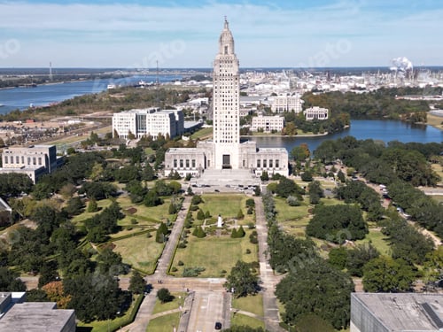 Preview: Drone view of the Louisiana State Capitol in Baton Rouge, Louisiana over green parks