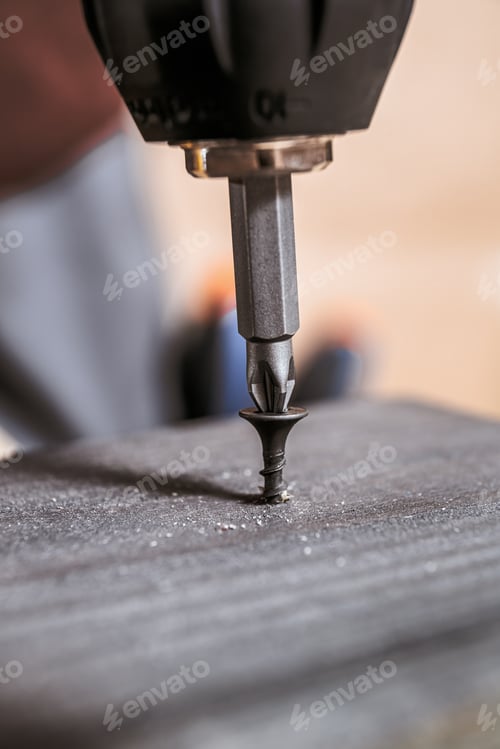 Preview: Drill Bit Driving Screw Vertically Into Wood
