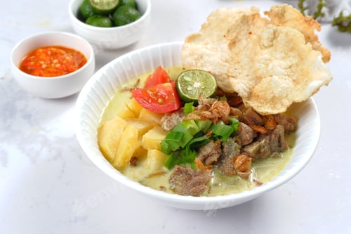 Preview: Soto Betawi. Traditional beef and offal soup from Betawi, Jakarta.