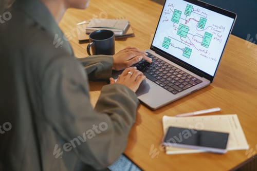 Preview: Young stylish woman working indoors