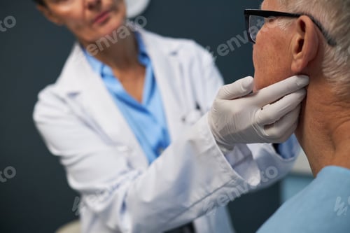 Preview: Medical Professional Examining Elderly Patient's Health