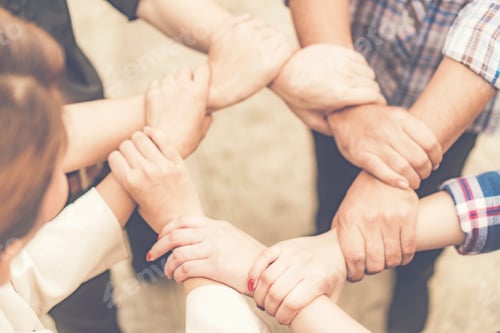 Preview: Group of business people crossed arms in pile for win. Stack of hands. Cooperation concept
