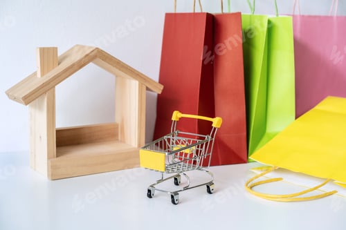 Preview: Colorful paper shopping bags on white table, Online shopping at home concept