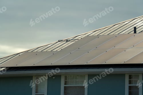 Preview: Standard american residential house with rooftop covered with solar photovoltaic panels