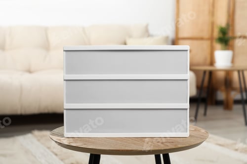 Preview: Blank light board on wooden table indoors