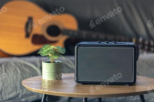 Preview: Close up, music speaker and acoustic guitar in the interior of the room.