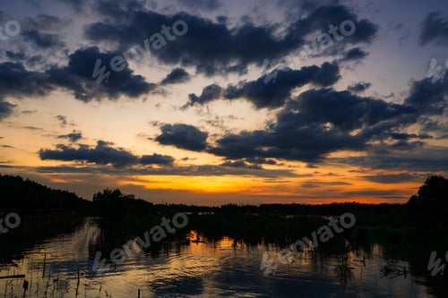 Preview: Sunset sky clouds in the Evening with Golden orange sunlight in golden hour, Dusk sky background