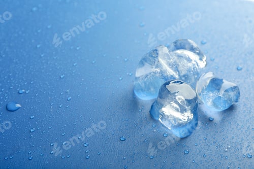 Preview: Ice forms on wet blue background, space for text
