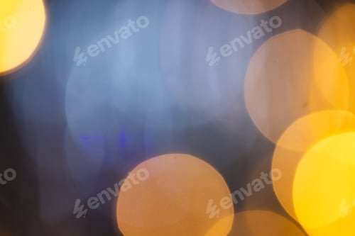 Preview: Multiple yellow bokeh lights with copy space on dark background