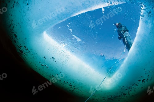 Preview: Russia, Arctic Circle Dive Centre, polar circle, guide holding tether for ice diving