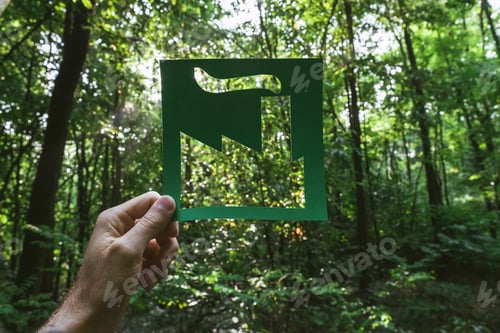 Preview: Hand holding eco friendly green living symbol