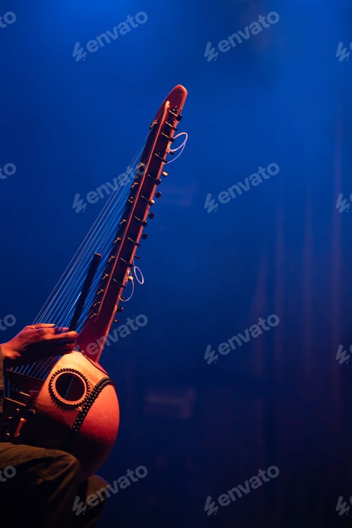 Preview: Muscian playing a string insturment called the Kora.