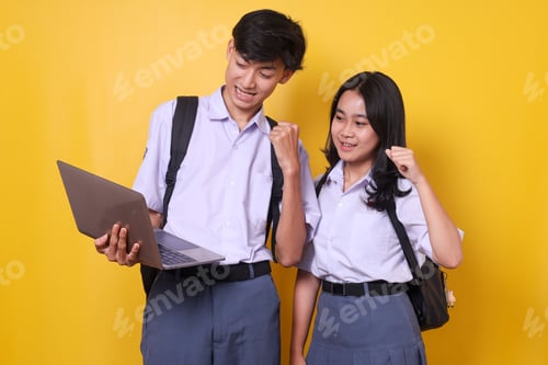 Preview: Excited Students Clenching Fist Showing Victory Gesture