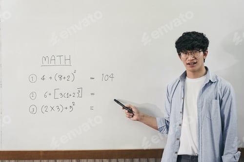 Preview: Asian male teacher is teaching students at the classroom while pointing at numbers