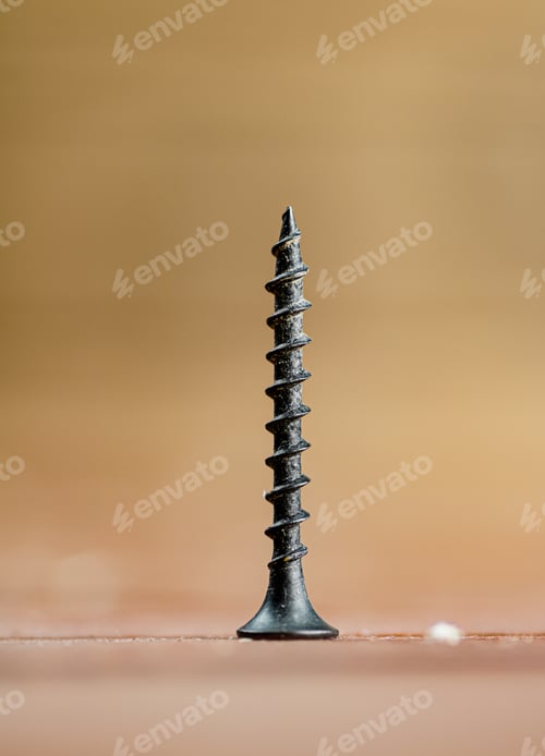 Preview: Self-tapping screw on wood on the table.