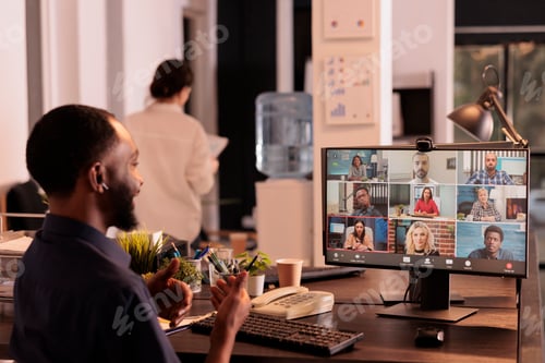 Preview: Employee discussing startup plan with remote team on teleconference